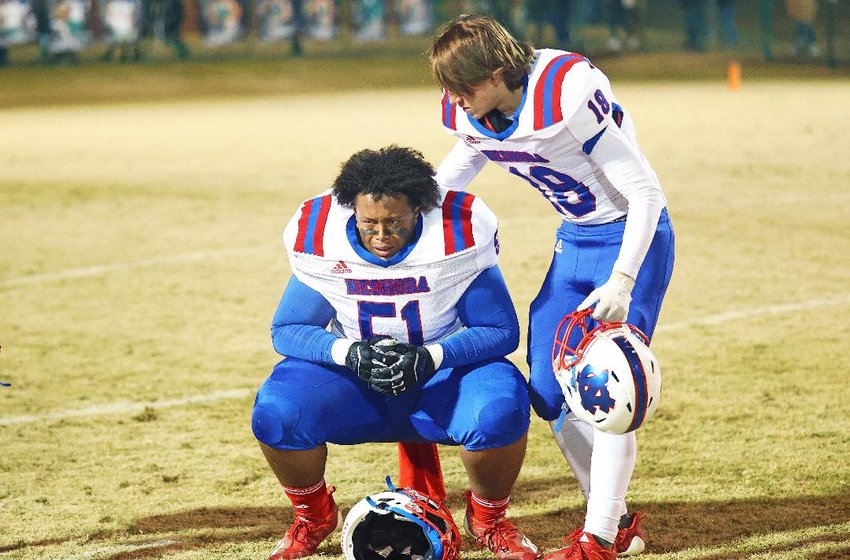 Neshoba Central’s Jaylon Brazzle (51) is comforted by teammate Jakob Knight after the Rockets fell 20-14 at West Point in the Class 5A North State championship game.